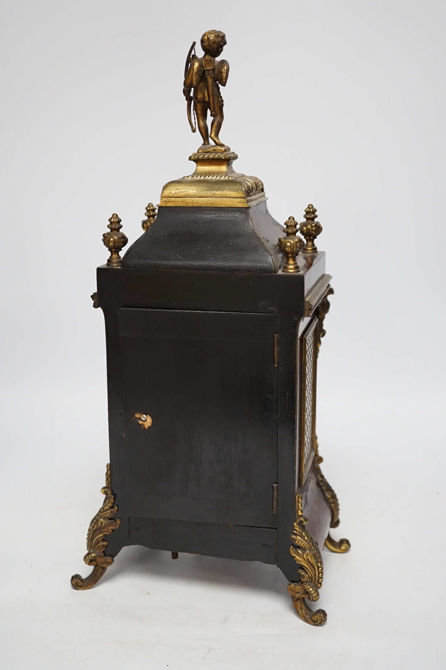 A late 19th century French tortoiseshell veneered mantel clock with cupid top, striking on a coiled gong, dial signed Benson, London, 39.5cm